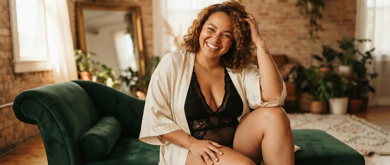 Empowering boudoir portrait celebrating body positivity and confidence